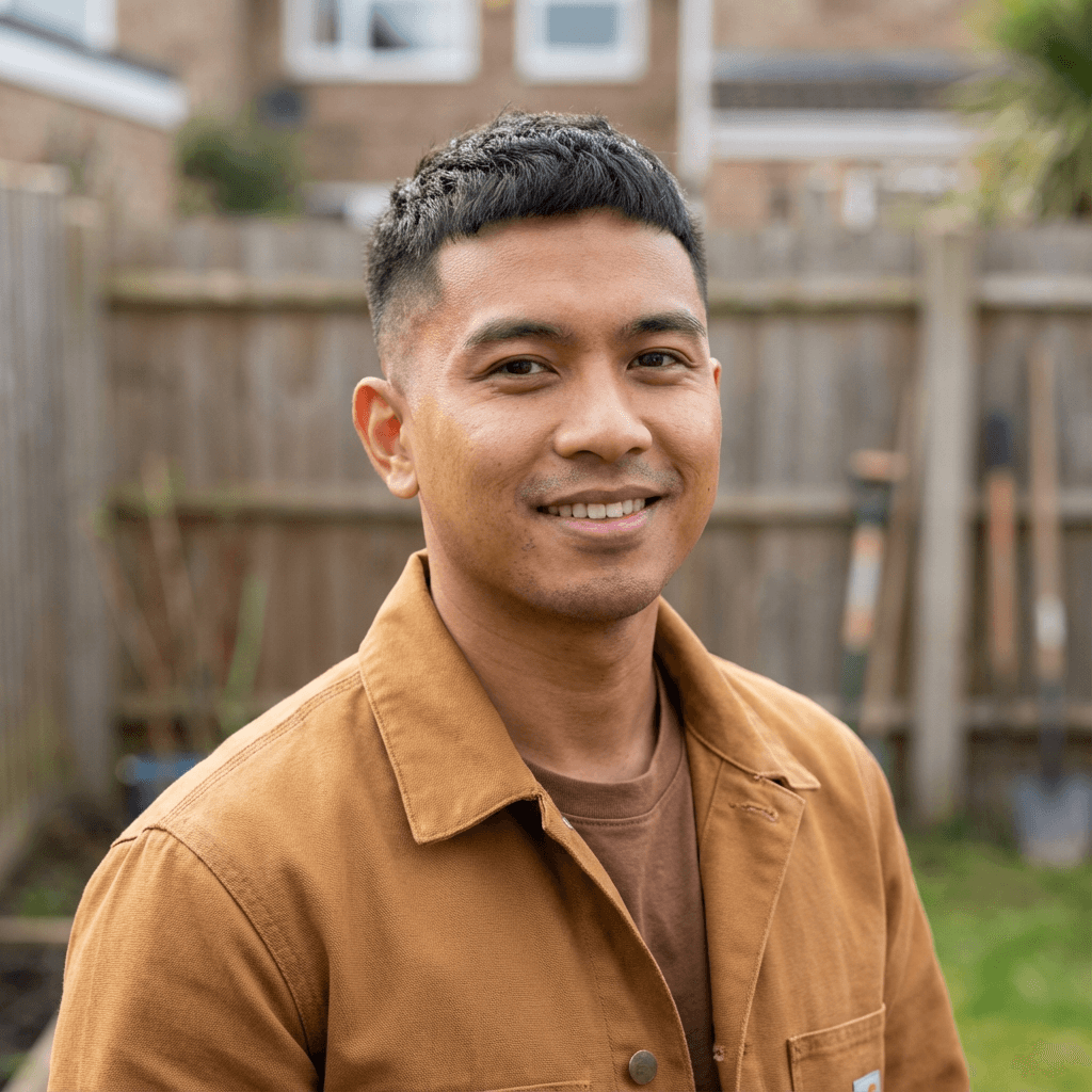 Marcus Chen smiling in a business casual shirt in a warehouse office